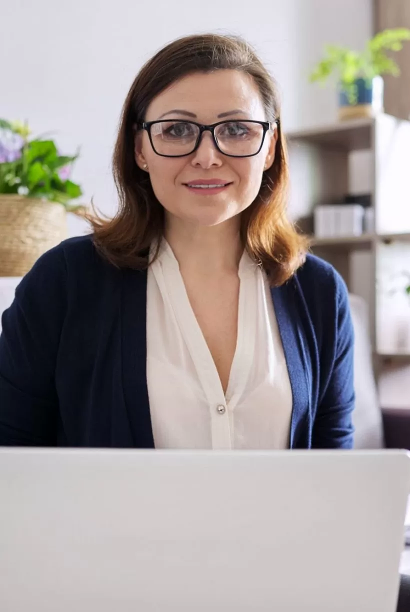mature-businesswoman-with-laptop-working-remotely-2021-12-14-00-31-49-utc